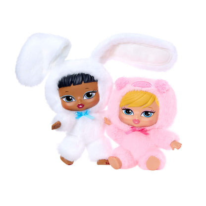 Two dolls one white bunny and the other a pink pig on a white background