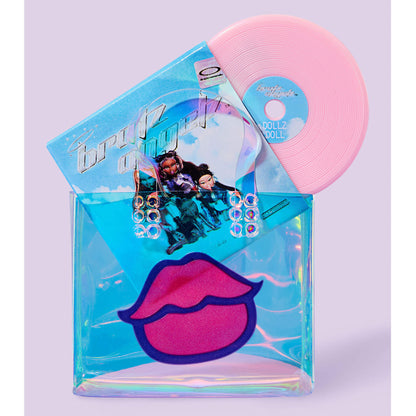 Pink mini record with sleeve in a clear vinyl bag with Pink lips on a purple background. 