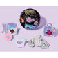 Collection of Bratz merchandise including a vinyl record, t-shirt, and accessories on a purple background.