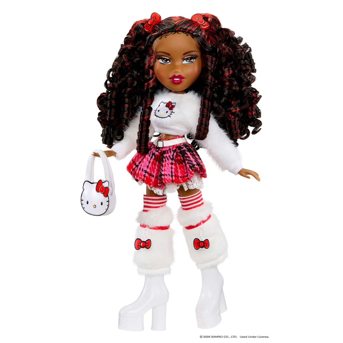 A Bratz Hello Kitty doll with dark curly hair, wearing a white fuzzy sweater, red and black plaid skirt, striped tights, white leg warmers, and white boots, holding a white Hello Kitty handbag against a white background.