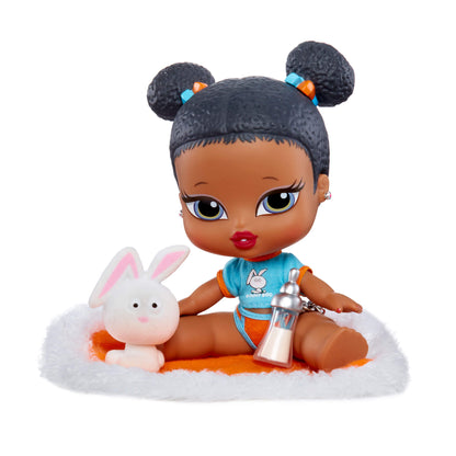 Sasha sitting on blanket with her pet bunny