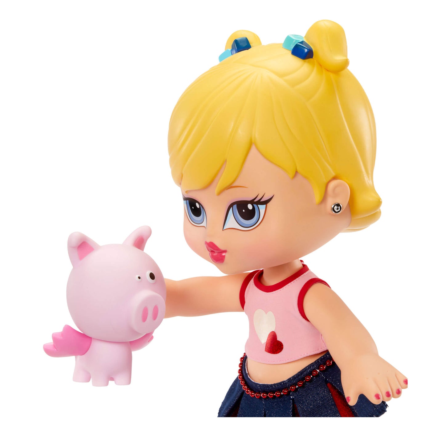 Toy figure of a girl with blonde hair holding a pink piggy