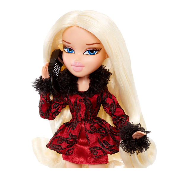 Doll in a red and black outfit with a phone