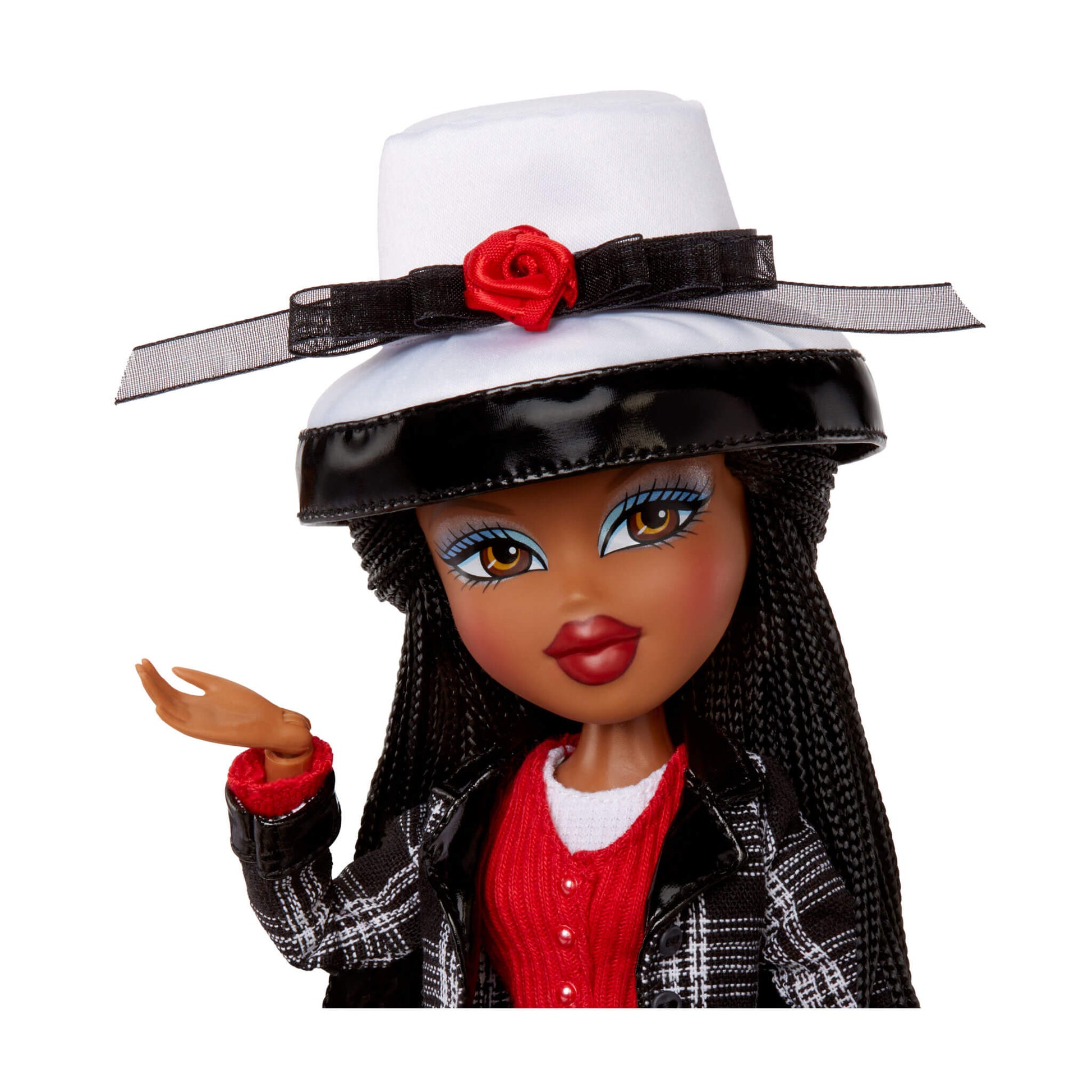Doll with a white hat, red flower, and plaid outfit 
