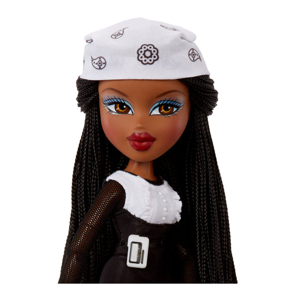 Doll with braided hair wearing a white cap and black outfit