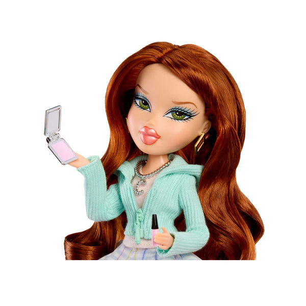 Doll with long brown hair holding a makeup compact and brush on a white background