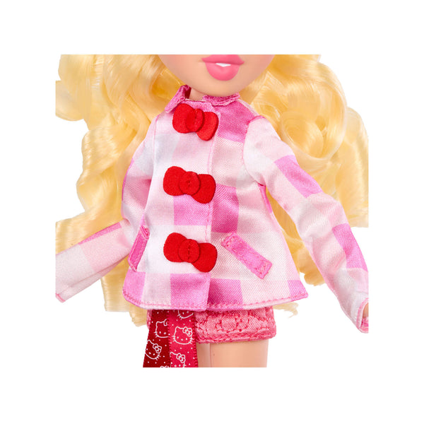 Close-up of a doll wearing a pink outfit with red bows on a white background