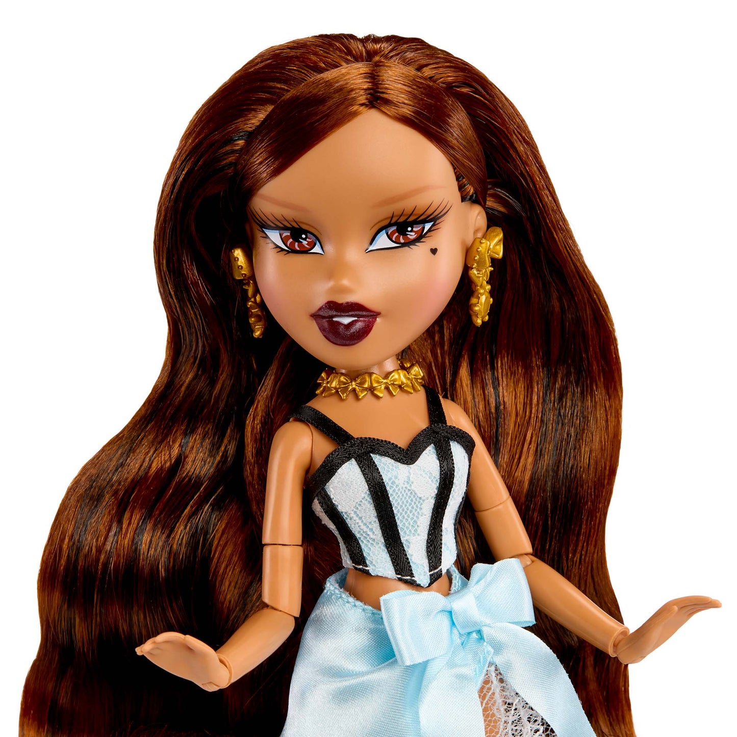Doll up-close with long brown hair, wearing a black and white striped top