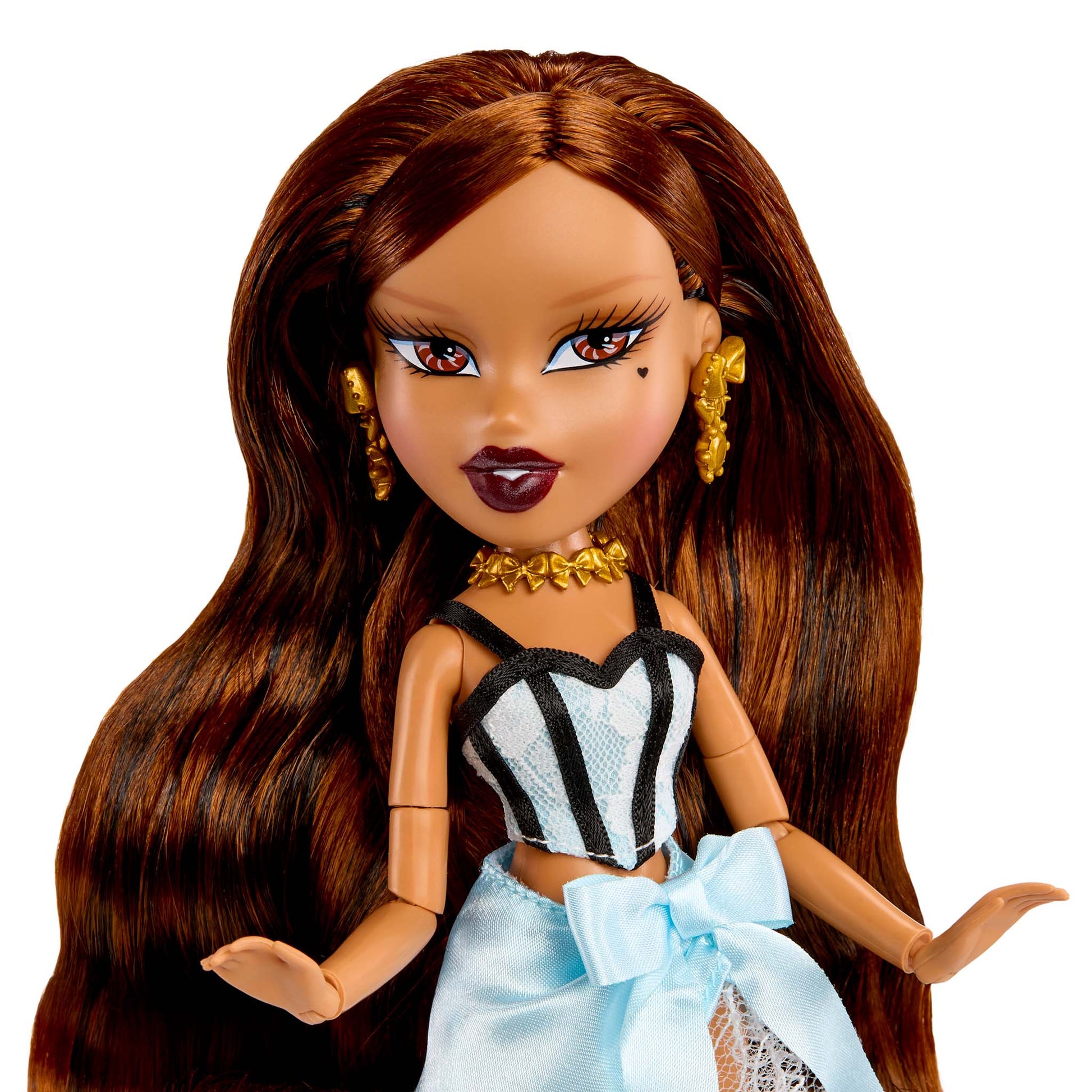 Doll up-close with long brown hair, wearing a black and white striped top
