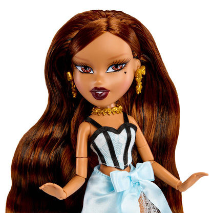Doll up-close with long brown hair, wearing a black and white striped top