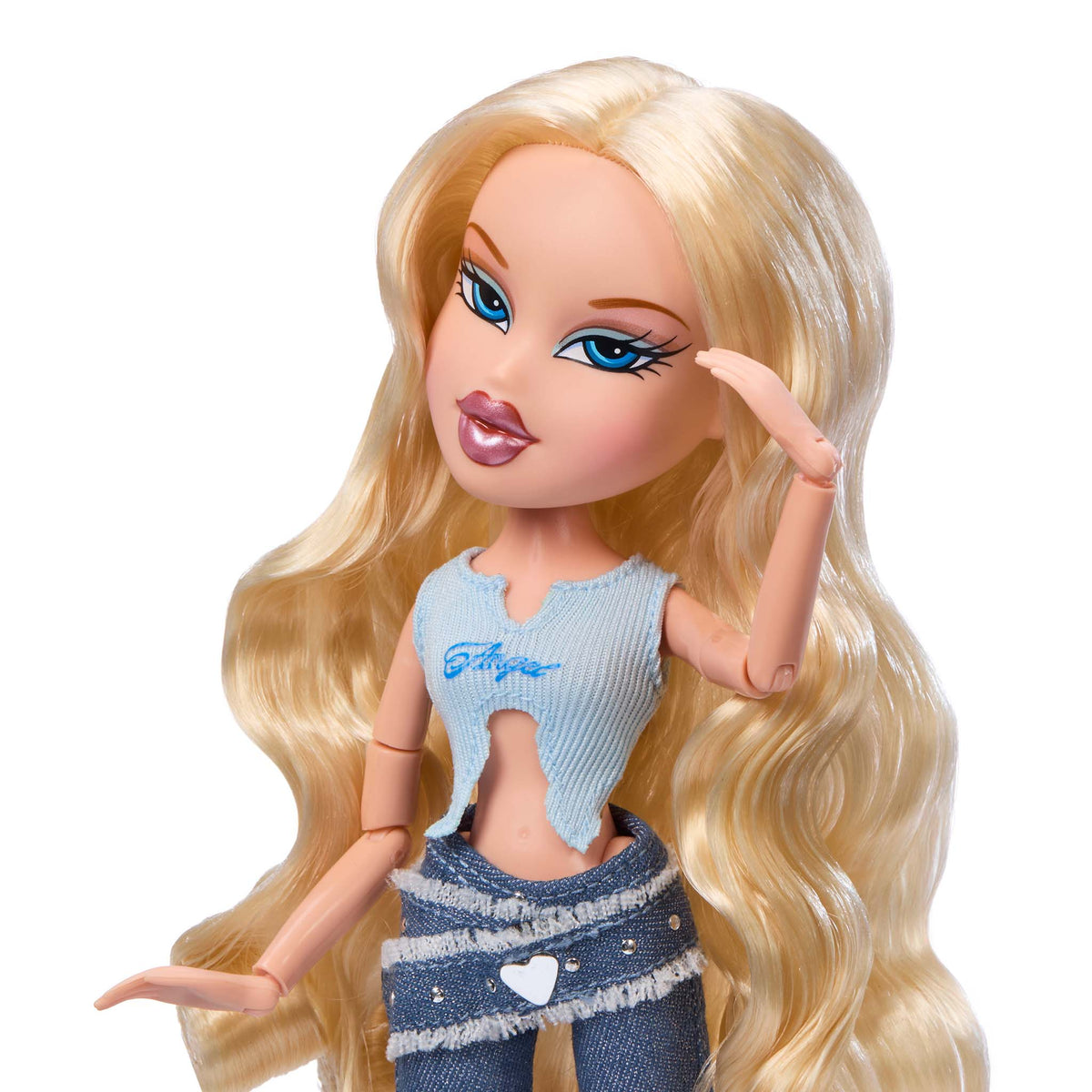 Cloe Bratz doll with long blonde hair, wearing a light blue top and denim jeans, shown close up