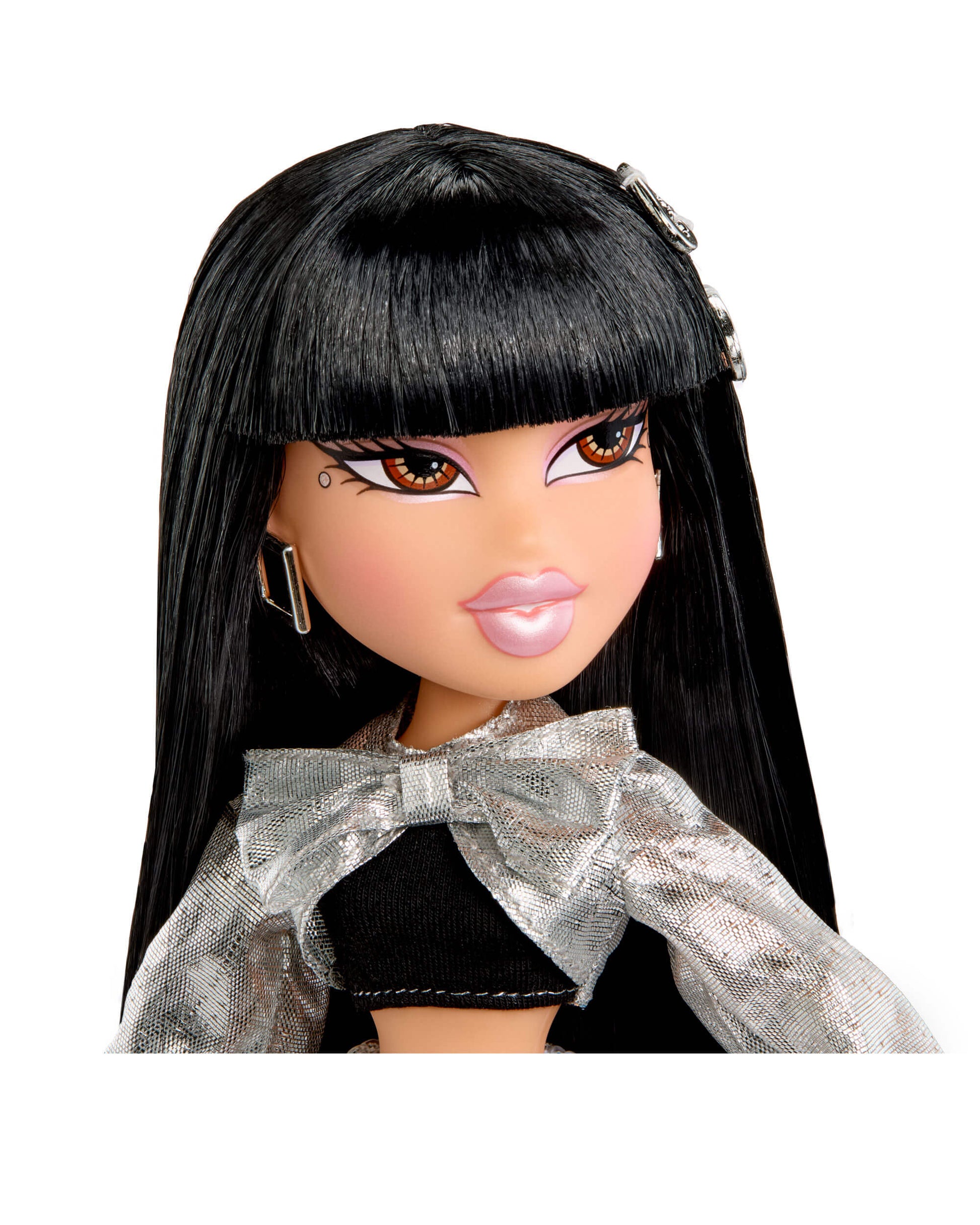 Close-up of a doll with long black hair and a silver bow on a white background