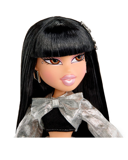 Close-up of a doll with long black hair and a silver bow on a white background