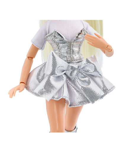 Doll wearing a silver dress with a large bow on a white background
