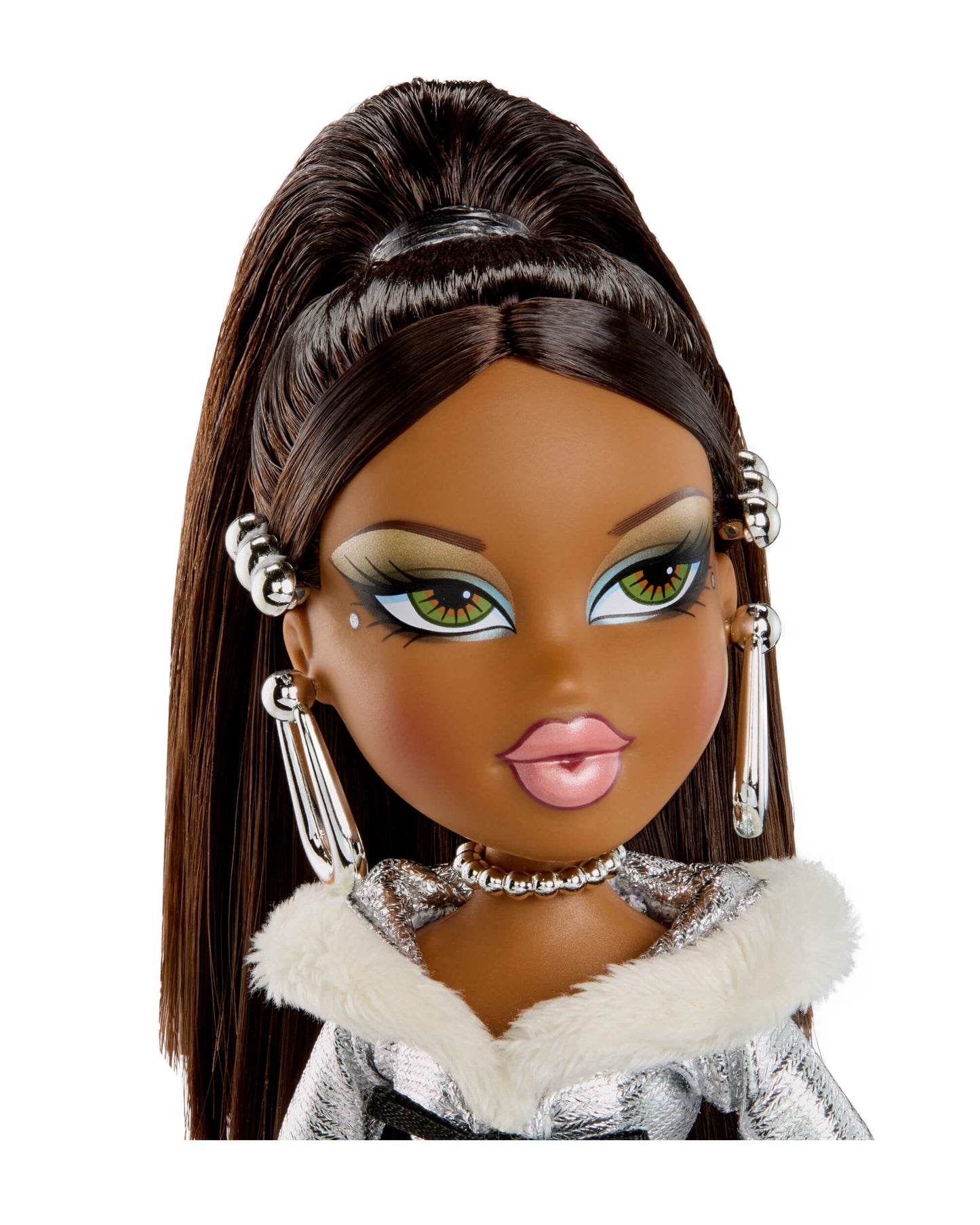 Doll with long brown hair, green eyes, and silver earrings on a white background