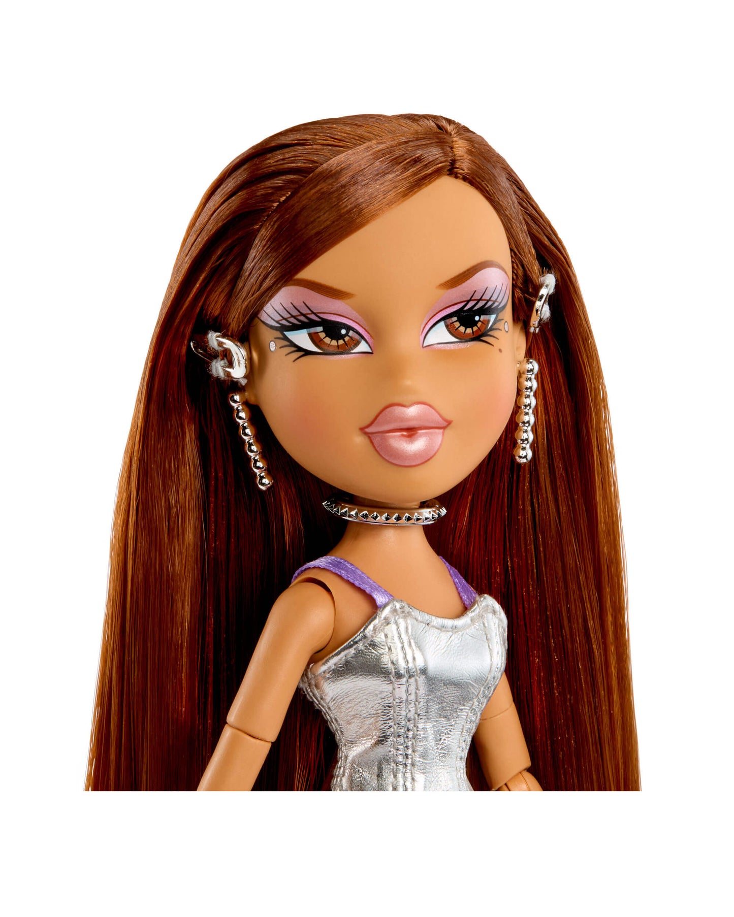 Doll with long brown hair and silver dress on a white background