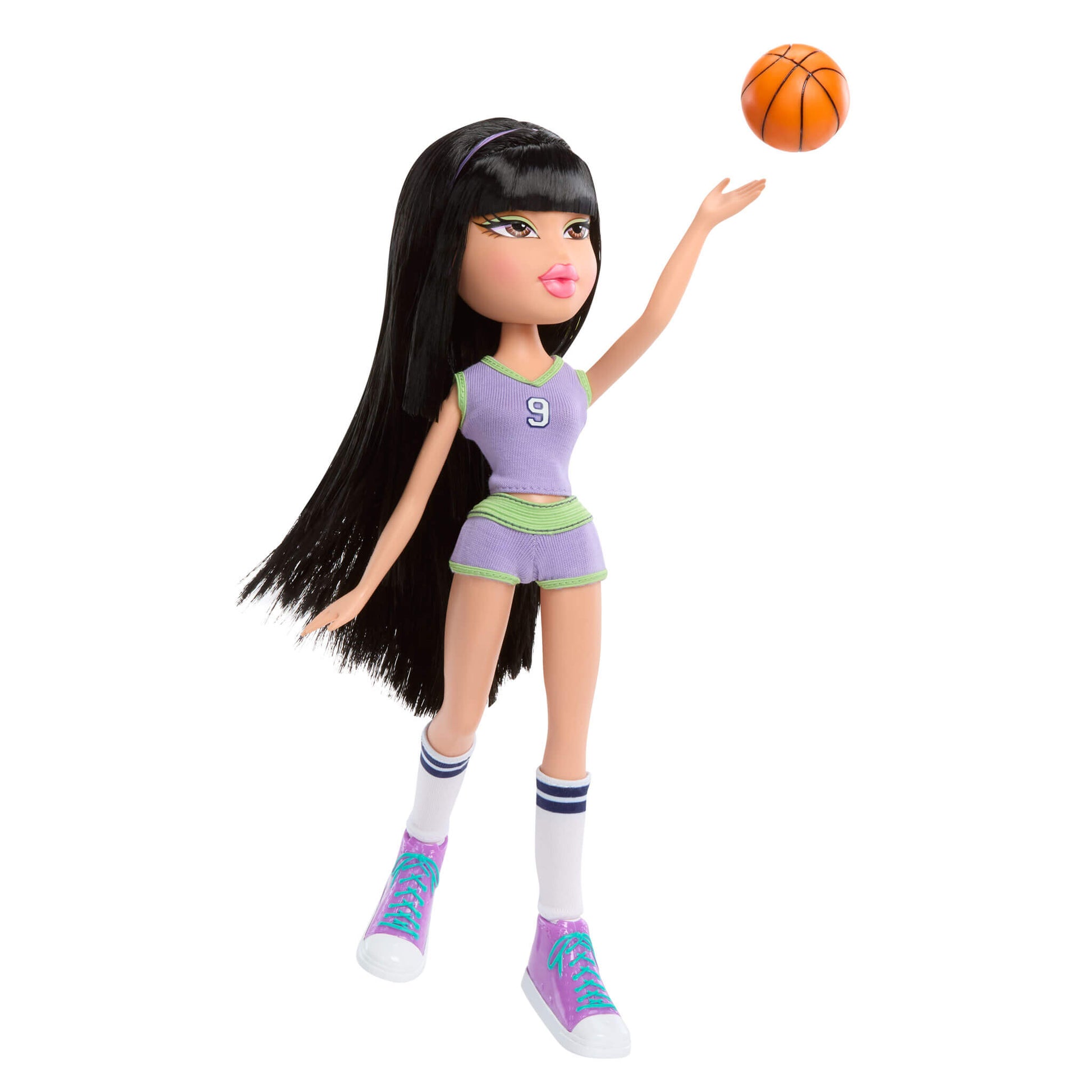 Doll in sports uniform with basketball 