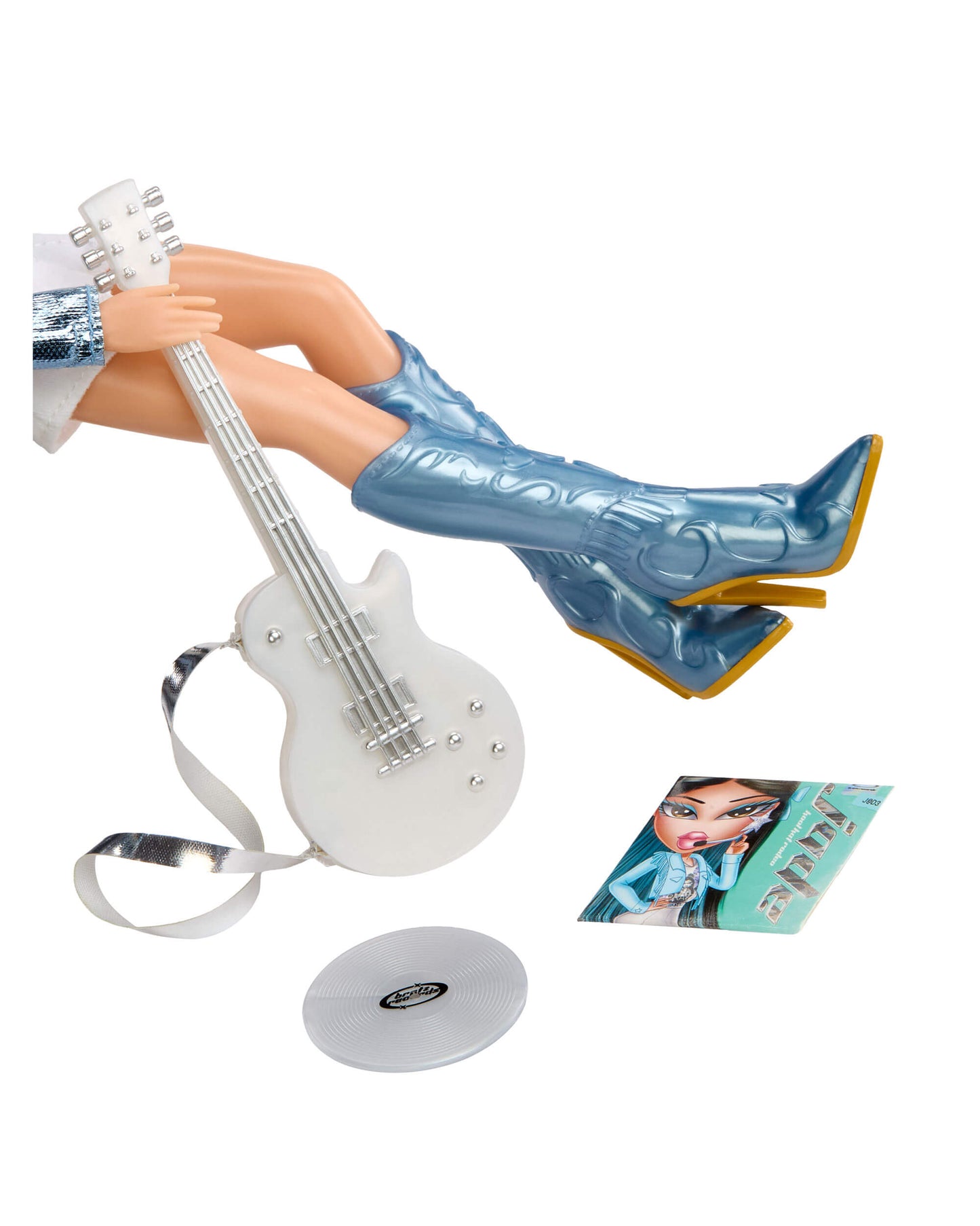 Doll's legs with knee high boots, guitar and accessories on a white background
