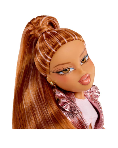 Close-up of a doll with long brown hair styled in a high ponytail, wearing a pink jacket.
