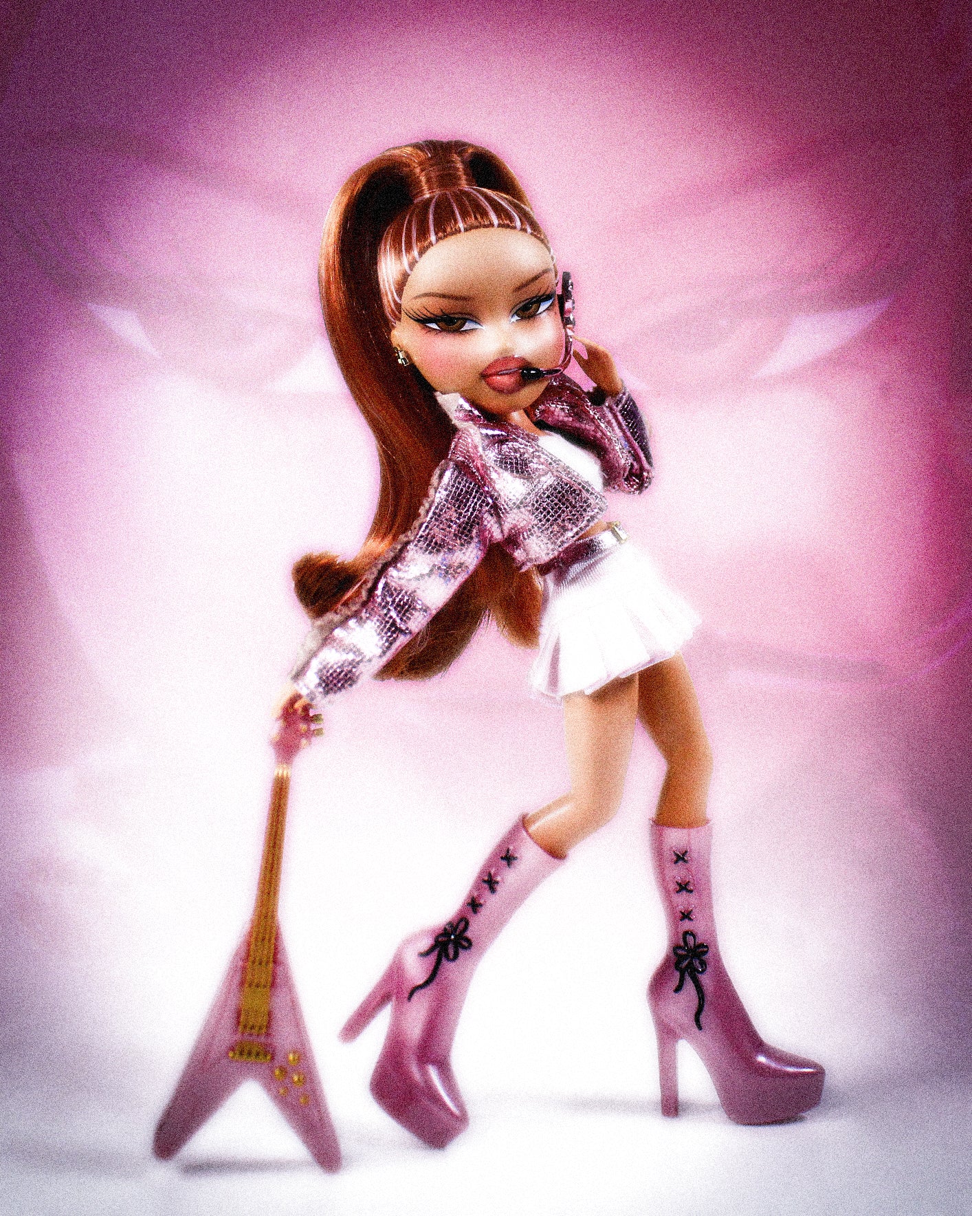 Pop Starz Yasmin Doll  doll with long brown hair, pink shoes, and a guitar on a pink background