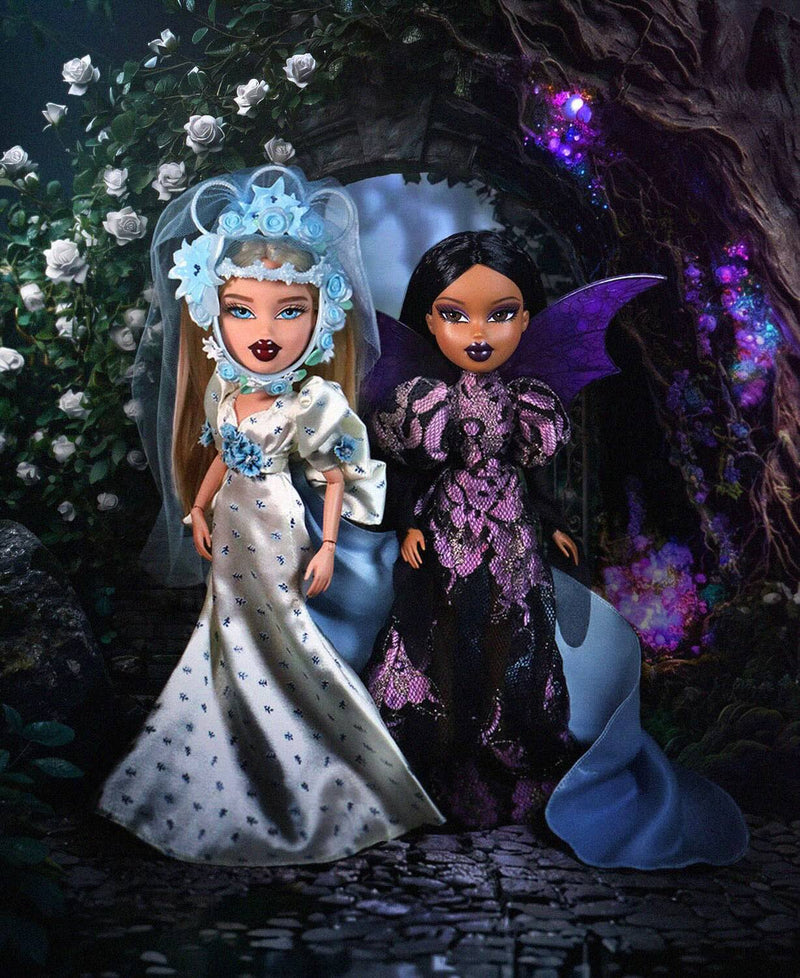 rodarte cloe and sasha dolls in standing in a mystical setting with flowers and foliage